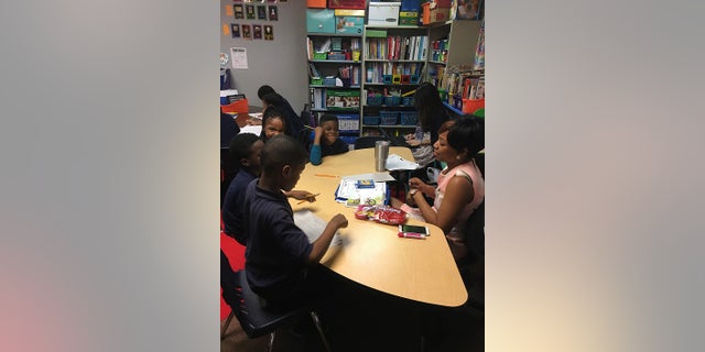 18-year-old Raven Osborne teaching elementary school children at 21st Century Charter School in Gary, Indiana on April 25, 2017.