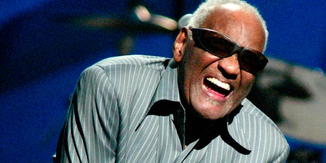 April 9, 2003. Ray Charles takes a bow after he sang with Willie Nelson at a concert in New York City.