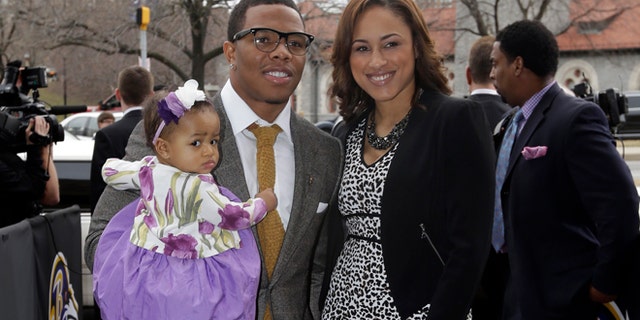 In this March 11, 2013 file photo, Baltimore Ravens running back Ray Rice, left, poses with his daughter, Rayven, and Janay Palmer as they arrive for a screening of a new film released on DVD that chronicles the team's championship NFL football season in Baltimore. Police in Atlantic City say Ray Rice and his fiance, Janay Palmer, were released on Saturday, Feb. 15, 2014, after they were arrested when an argument turned physical at the Revel Casino.