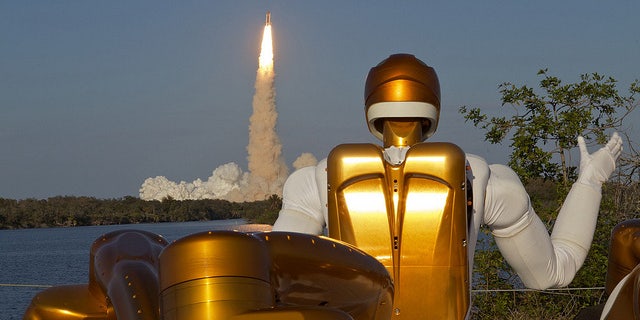 Robonaut R2A waving goodbye as Robonaut R2B launches into space aboard STS-133. R2 is the first humanoid robot in space.