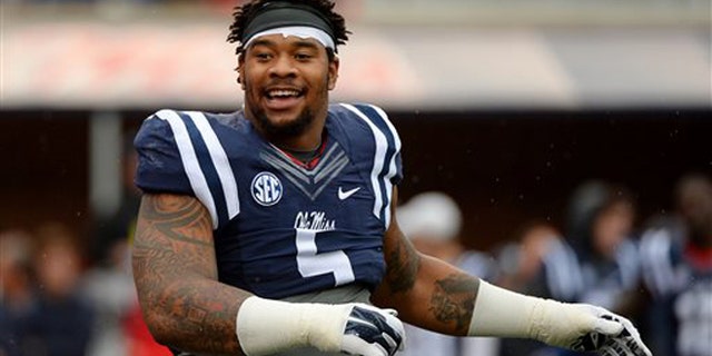 Nov. 7, 2015: Mississippi defensive tackle Robert Nkemdiche stretches before an NCAA college football game against Arkansas in Oxford, Miss. (AP Photo/Thomas Graning)