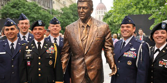 June 29: US Air Force and Army officers, serving in Hungary, pose with the new statue of late US President Ronald Reagan after a centennial commemoration in Budapest, Hungary.