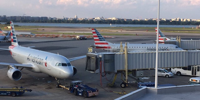 Planes wait for clearance to take off from Reagan Washington National Airport in Arlington County, Va. Monday evening.