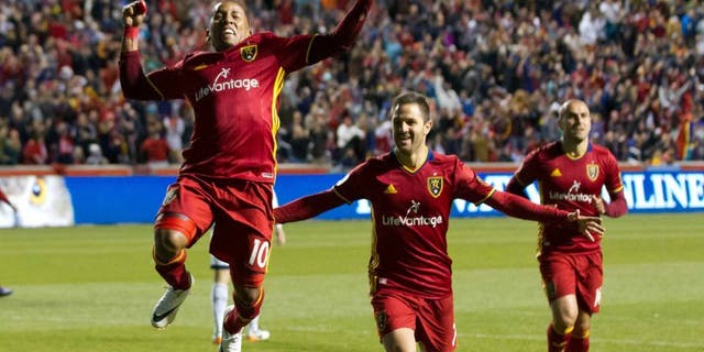Apr 16, 2016; Sandy, UT, USA; Real Salt Lake forwards Juan Manuel Martinez (right) and Joao Plata (10) celebrate a goal during the second half against the Vancouver Whitecaps at Rio Tinto Stadium. Real Salt Lake won 1-0. Mandatory Credit: Russ Isabella-USA TODAY Sports
