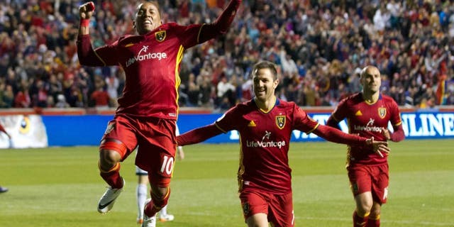 Apr 16, 2016; Sandy, UT, USA; Real Salt Lake forwards Juan Manuel Martinez (right) and Joao Plata (10) celebrate a goal during the second half against the Vancouver Whitecaps at Rio Tinto Stadium. Real Salt Lake won 1-0. Mandatory Credit: Russ Isabella-USA TODAY Sports