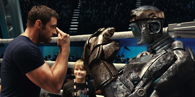Hugh Jackman, left, and Dakota Goyo are shown in a scene from 'Real Steel.'