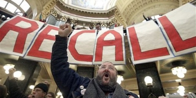 FILE: Jan. 17, 2012: Protesters including labor union supporters at a rally at the Wisconsin State Capitol in Madison, Wisc.