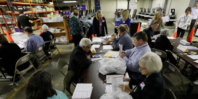 Workers begin a statewide presidential election recount Thursday, Dec. 1