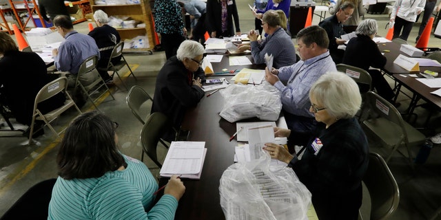 Workers begin a statewide presidential election recount Thursday, Dec. 1