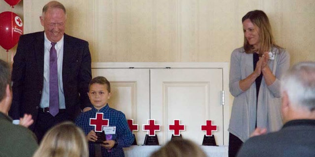 J.T. Parker receives his American Red Cross East Idaho Real Hero award.