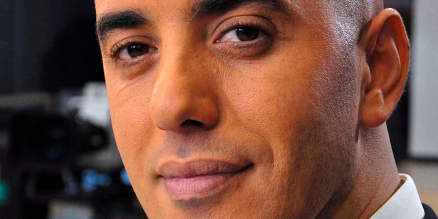 In this photo dated Nov. 22, 2010, notorious French criminal Redoine Faid poses prior to an interview with French all-news TV channel, LCI, as he was promoting his book, in Boulogne-Billancourt, outside Paris, France.