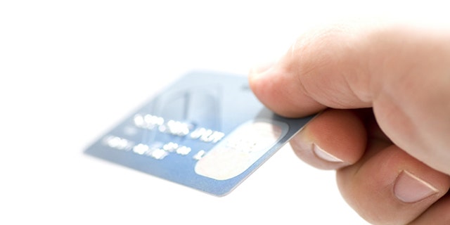 Hand holding credit cards. Small DOF