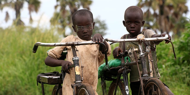 Refugee children from South Sudan ride their bicycles at Palorinya settlement in Moyo district northern Uganda October 25, 2017