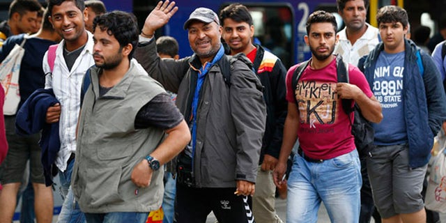 Refugees arrive at the main station in Munich last week after Austria and Germany threw open their borders to thousands bused to the Hungarian border by a right-wing government that had tried to stop them but was overwhelmed by the sheer numbers. (Reuters)