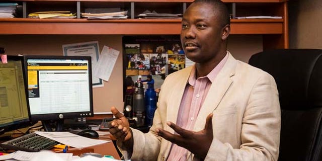 Zeze Rwasama, director of College of Southern Idaho Refugee Programs, talks to a reporter in his office in Twin Falls, Idaho.
