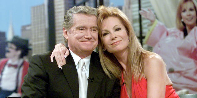 Talk show host Kathie Lee Gifford (R) hugs her co-host Regis Philbin during Gifford's final appearance on their popular morning show 