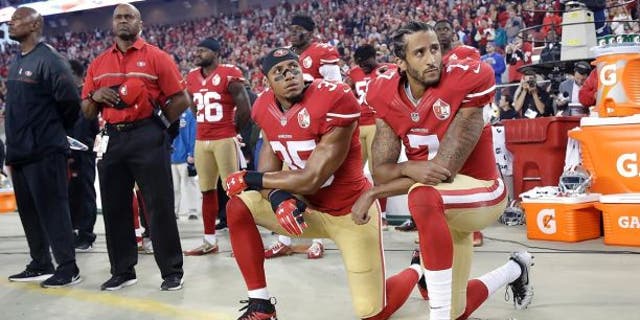 Eric Reid, left, kneels before the national anthem alongside Colin Kaepernick in 2016.