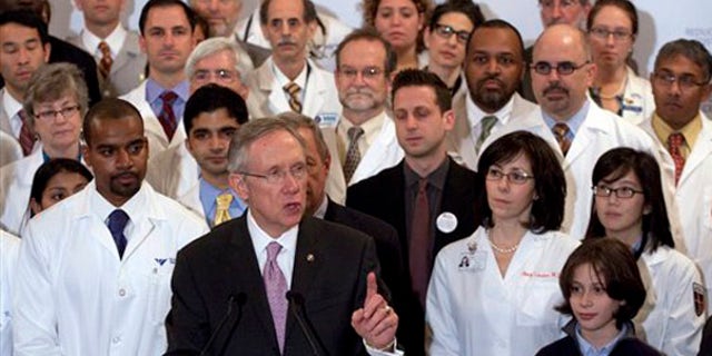 Senate Majority Leader Harry Reid, D-Nev., surrounded with doctors, speaks at a health care news conference on Capitol Hill in Washington, Thursday, Dec. 10, 2009. (AP)