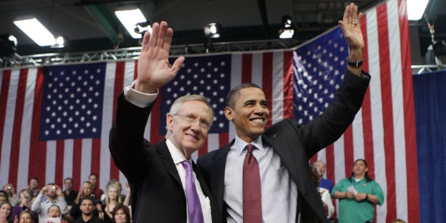 Feb. 19: President Obama and Senate Majority Leader Harry Reid wave following a town hall meeting in Henderson, Nev. (AP)