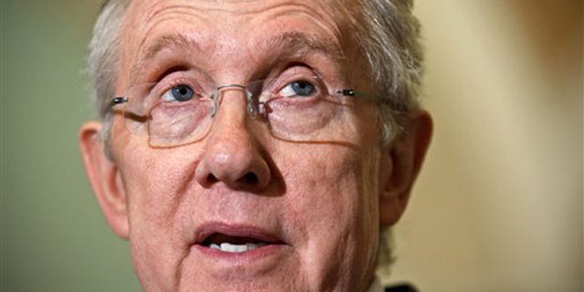 FILE: Senate Majority Leader Harry Reid speaks to reporters on Capitol Hill in Washington.