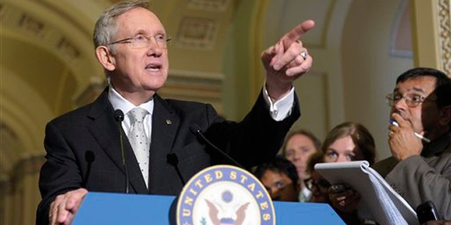Senate Majority Leader Harry Reid speaks to reporters on Capitol Hill in Washington June 21.