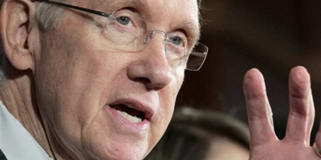 Senate Majority Leader Harry Reid gestures during a news conference on Capitol Hill Sept. 23 to discuss his fight with Republican lawmakers over whether funding for victims of natural disasters should be paid for by cuts to other government programs.