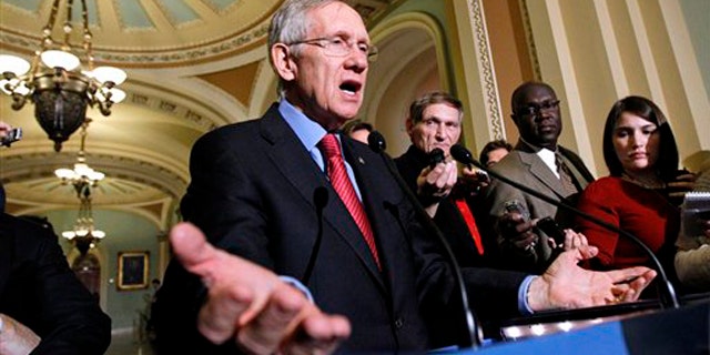 Senate Majority Leader Harry Reid gestures during a news conference on Capitol Hill Dec. 8. (AP Photo)