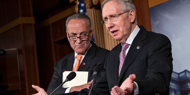 Oct. 2, 2013: Senate Majority Leader Harry Reid of Nev., right, accompanied by Sen. Charles Schumer, D-N.Y., speaks on Capitol Hill.