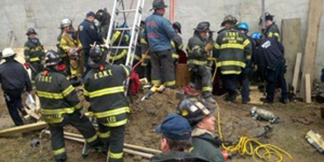 March 2: New York firefighters work to rescue a man trapped in a structural collapse in Harlem, New York.
