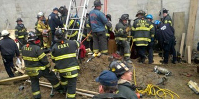 March 2: New York firefighters work to rescue a man trapped in a structural collapse in Harlem, New York.