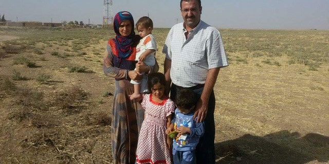 Shujaa, seen here with former Yazidi captives, cannot divulge all the methods used to free women from ISIS.