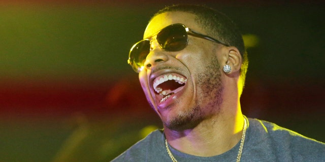 Rapper Nelly laughs on stage during a Corner Block Party concert at Auburn University in Auburn, Ala. in this April 18, 2015, file photo.
