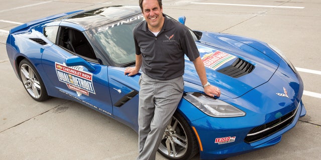 Mark Reuss with the 2013 Chevrolet Corvette Stingray pace car prior to driving it at the 2015 Iindycar Detroit Grand Prix