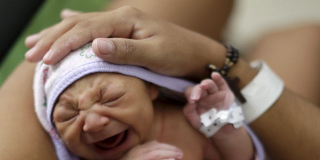 Jan. 28, 2016: Sueli Maria holds her daughter Milena, who has microcephaly, at a hospital in Recife, Brazil.