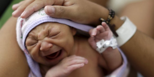 Jan. 28, 2016: Sueli Maria holds her daughter Milena, who has microcephaly, at a hospital in Recife, Brazil.