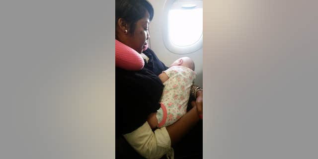 Nyfesha Miller stepped in to help quiet a stranger's newborn on a long flight.
