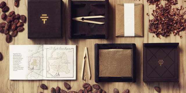 Each bar of this luxury chocolate comes tucked in a Spanish elm box, with special tasting tools, and a booklet.