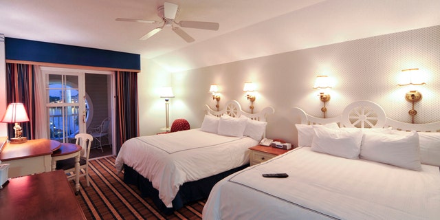 Decorated in blues and whites, a nautical theme is carried throughout the spacious rooms at Disneyâs Yacht Club Resort, a deluxe-category hotel at Walt Disney World Resort in Lake Buena Vista, Fla. Showcasing rich millwork and brass, porthole windows, a marina and lighthouse, this New England-inspired clapboard hotel offers 621 luxurious rooms and suites and a 73,000-square-foot convention center. It is located on Crescent Lake in the heart of Disney property. (Garth Vaughan, photographer)