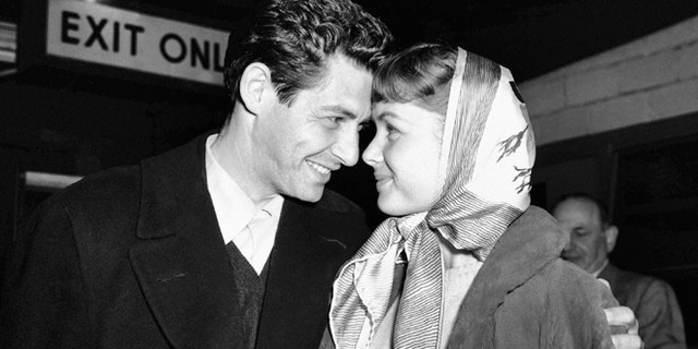 Singer Eddie Fisher and actress Debbie Reynolds, have eyes only for each other at Idlewild Airport, April 19, 1955, in New York after arriving from England.