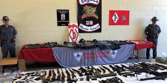 Authorities on Wednesday arrested 50 members of two rival biker gangs in Rhode Island, seizing 53 illegal guns and large quantities of narcotics.
