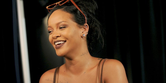 Rihanna talks to media backstage after Savage X Fenty fashions are shown in a performance at the Brooklyn Navy Yard at the end of Fashion Week, Wednesday Sept. 12, 2018, in the Brooklyn borough of New York. Rihanna unleashed the wild beast in a lush tropical land to debut her second season of Savage x Fenty lingerie and loungewear. (AP Photo/Diane Bondareff)