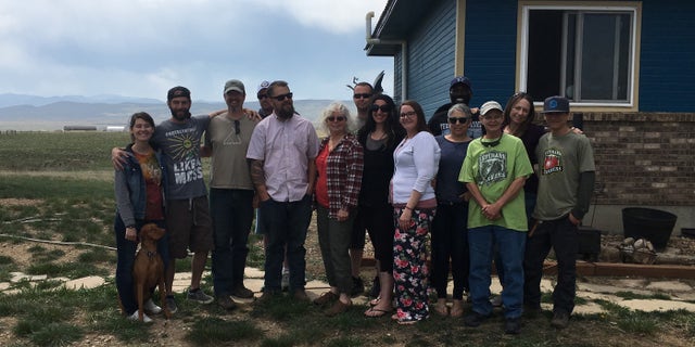Rich Murphy, at left, with a range of past and current participants in the Veterans to Farmers program at his home in Fort Collins, Colorado.