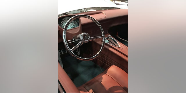 The 150's ho-hum interior has been given a sleek, retro-futuristic overhaul crowned by a chrome steering wheel.