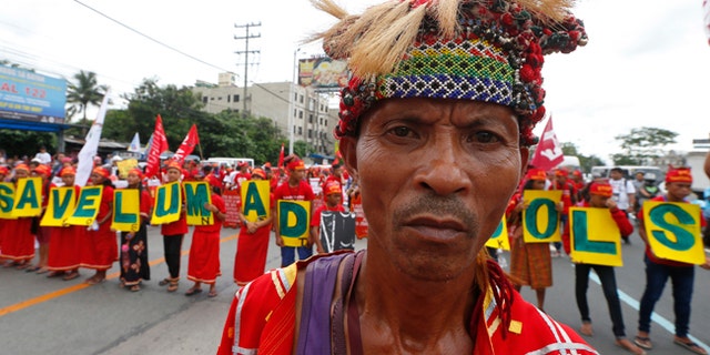 Young indigenous people known as Lumads march to coincide with Philippine President Rodrigo Duterte's state of the nation address.
