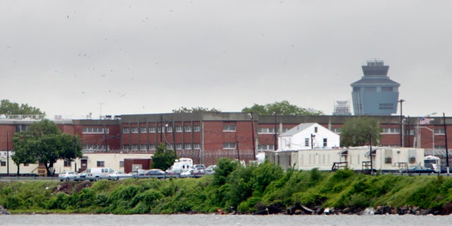 In this May 17, 2011 file photo, the East River flows past New York Citys Rikers Island correctional facility. The operating of Rikers Island consumes a large chunk of the New York City jail systems budget. It costs nearly as much to jail a city inmate for a year as it does to pay for four years tuition at a private college.