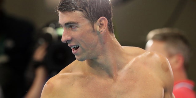 Aug, 13, 2016: United States' Michael Phelps leaves the pool deck after his team won gold in the men's 4 x 100-meter medley relay final during the swimming competitions at the 2016 Summer Olympics in Rio de Janeiro, Brazil.