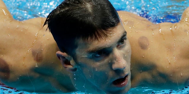 United States' Michael Phelps leaves the pool after winning a heat of the men's 200-meter individual medley during the swimming competitions at the 2016 Summer Olympics, Wednesday, Aug. 10, 2016, in Rio de Janeiro, Brazil. (AP Photo/Matt Slocum)