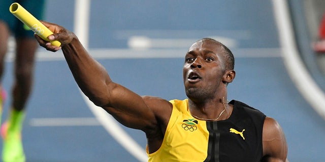 Jamaica's Usain Bolt celebrates winning the gold medal in the men's 4x100 meters relay final during athletics competitions of the 2016 Summer Olympics at the Olympic Stadium in Rio de Janeiro, Brazil, Friday, August 19, 2016.