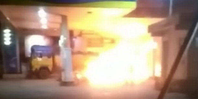 The truck was engulfed in huge flames as Khan drove it from the station.