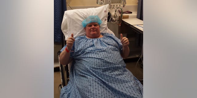 Former Toronto mayor Rob Ford gives the thumbs up sign before cancer surgery at Mount Sinai Hospital in Toronto.